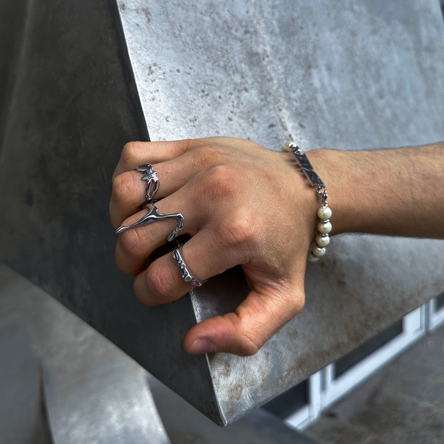 On hand view of our silver liquid ring in high quality stainless steel and waterproof function