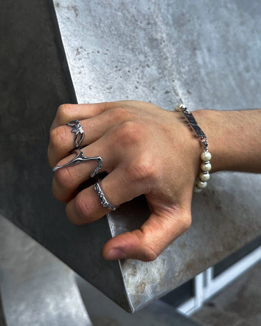 On hand view of our silver liquid ring in high quality stainless steel and waterproof function